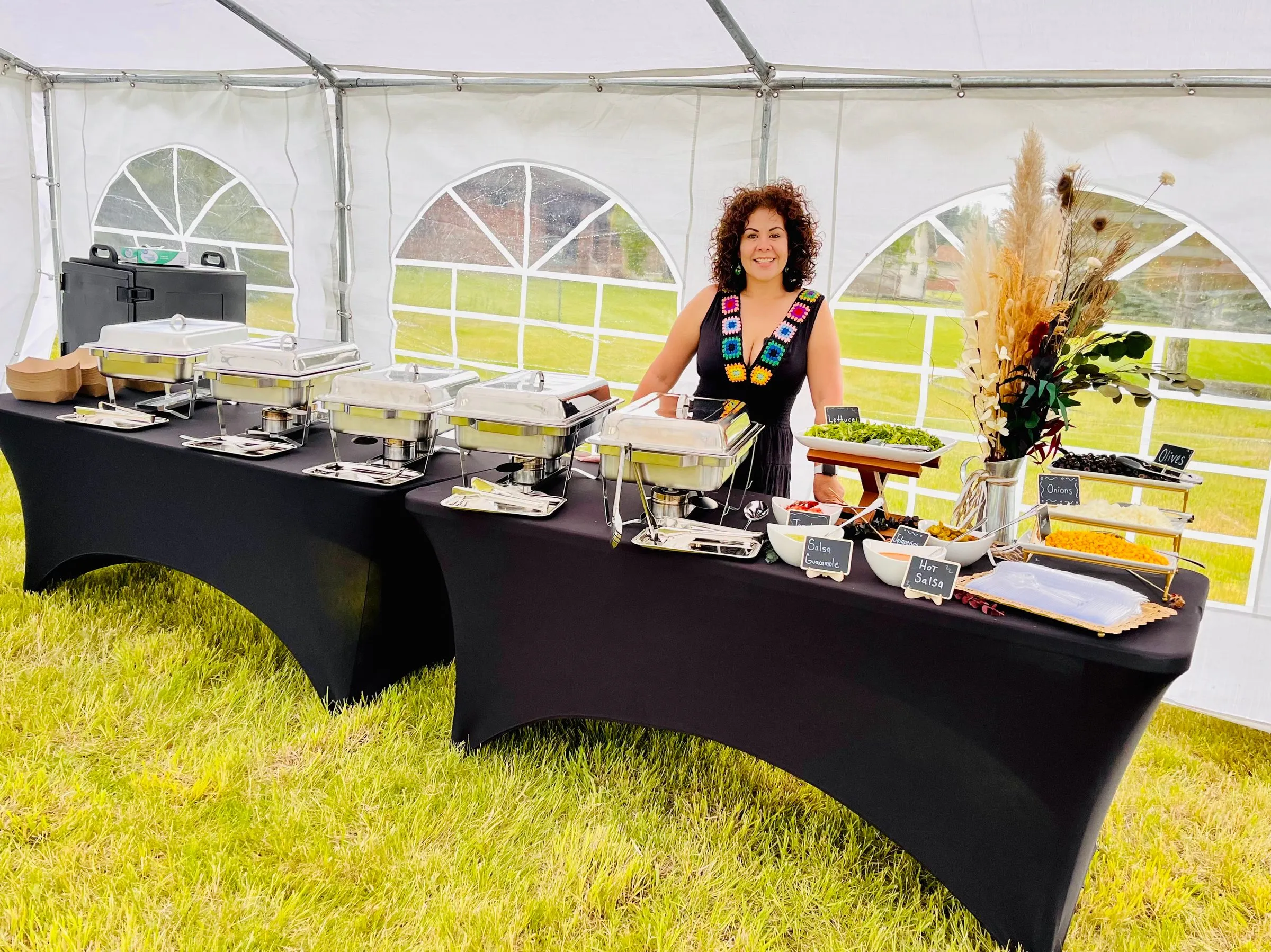 A catered spread laid out for a wedding reception.