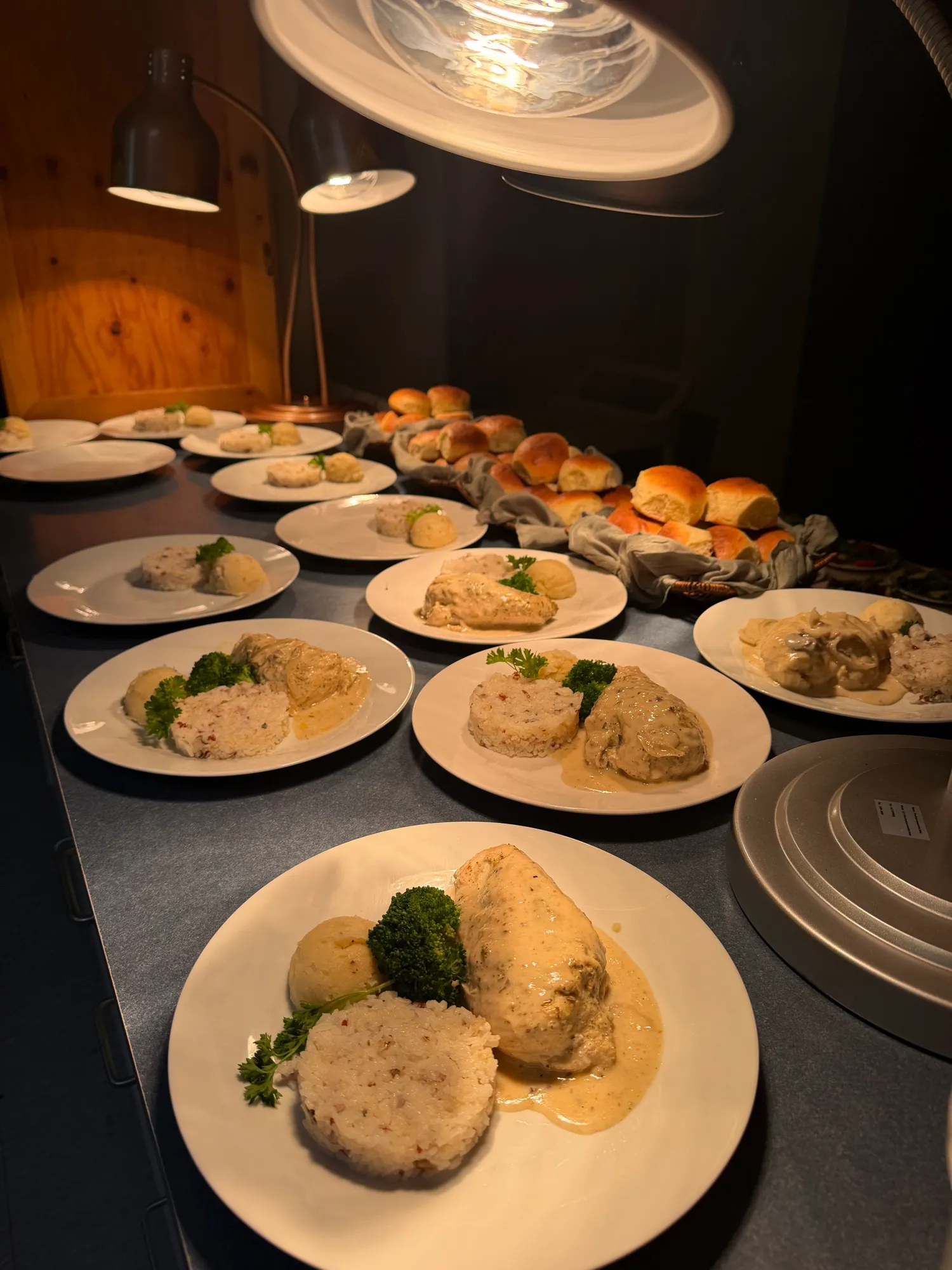 Plated servings garnished and lined up ready to go out.